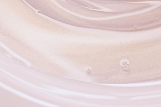 Glowing cosmetic emulsion, rose gold cream or lotion as beauty and skincare background closeup