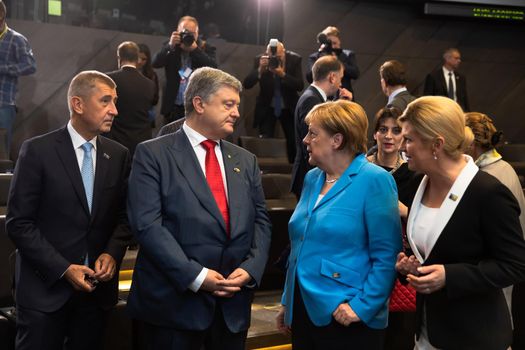 BRUSSELS, BELGIUM - Jul 12, 2018: Ukrainian President Petro Poroshenko and German Chancellor Angela Merkel during NATO military alliance summit in Brussels