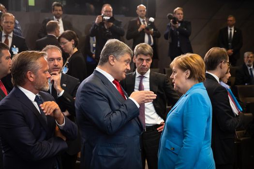 BRUSSELS, BELGIUM - Jul 12, 2018: Ukrainian President Petro Poroshenko and German Chancellor Angela Merkel during NATO military alliance summit in Brussels