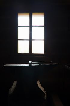 Blacksmith's hammer on the anvil in backlight - hammer and anvil