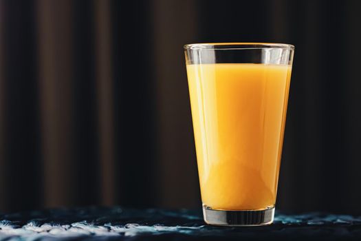 Glass of orange juice, healthy drink closeup