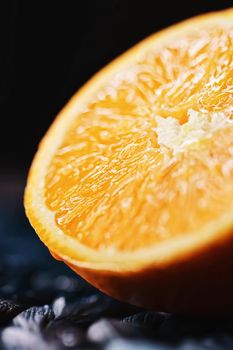 Juicy oranges half cut and sliced, healthy food and fruit closeup