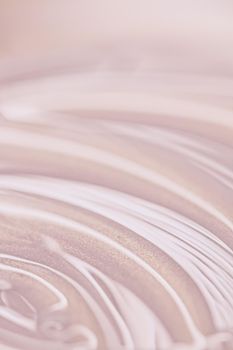 Glowing cosmetic emulsion, rose gold cream or lotion as beauty and skincare background closeup