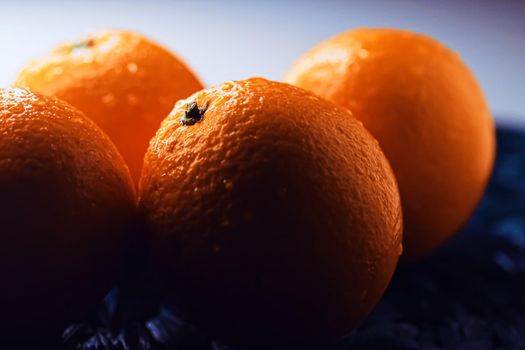 Organic oranges fresh from the garden, healthy food and fruits closeup