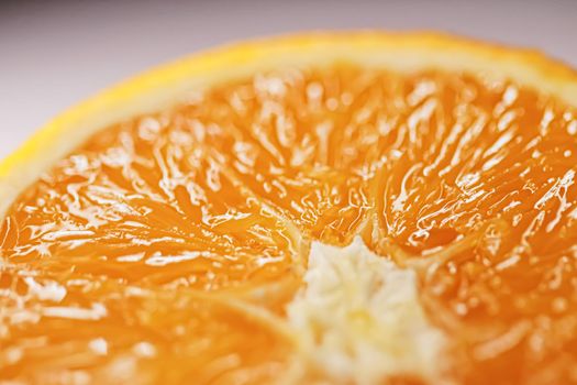 Juicy oranges half cut and sliced, healthy food and fruit closeup