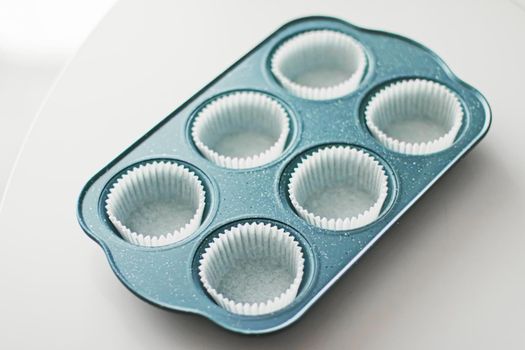 Chocolate muffin or cupcake batter in a pan ready to bake, homemade comfort food recipe concept