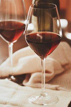 Traditional red house wine served in crystal glasses, closeup