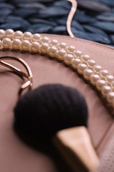 Jewellery and makeup tools inside a womans purse, beauty and fashion closeup