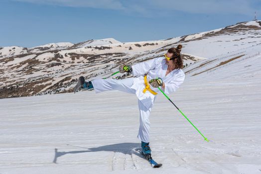 Skier dressed as a karateka at a ski station.