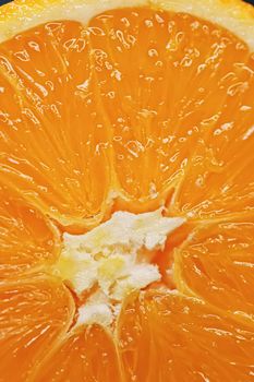 Juicy oranges half cut and sliced, healthy food and fruit closeup