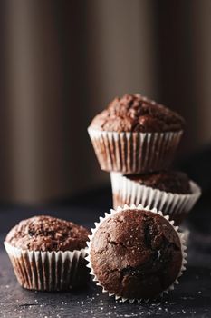 Homemade chocolate muffins, baked comfort food recipe concept