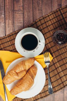 croissants in a plate on the table meal dessert for breakfast. High quality photo