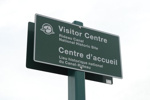 SMITHS FALLS, ONTARIO, CANADA, MARCH 10, 2021: Closeup view of the sign for the Rideau Canal National Historic Site Headquarters Visitor Centre located downtown Smiths Falls, ON, on a late winter afternoon.