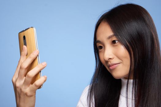pretty brunette phone in hands communication device technology. High quality photo