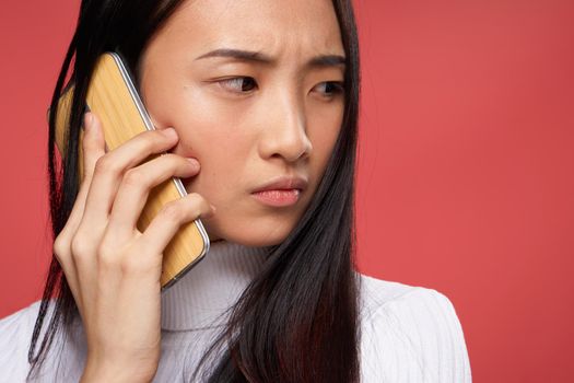 adult woman talking on the phone discontent conflict technology close-up. High quality photo