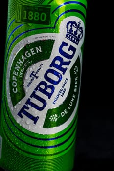 Condensation water droplets on Tuborg beer can isolated on black. Bucharest, Romania, 2020