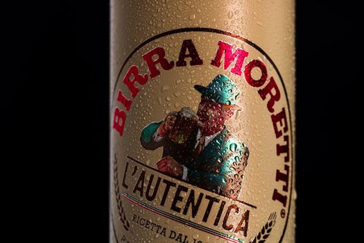 Birra Moretti, a premium lager beer with water droplets on black background. Studio photo shoot in Bucharest, Romania, 2021