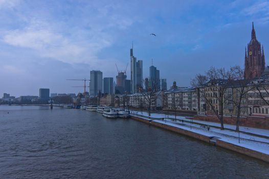 Frankfurt, Snowy day city view by the river Rhein, Germany, Europe