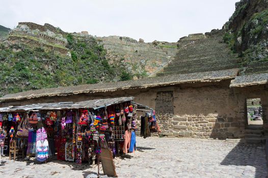 Sacred Valley, Ollantaytambo Ancient city view with traditional clothes shop, Peru, South America