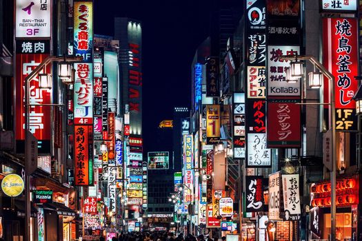 Tokyo - November 18: Advertisement billboards and signs on Kabukicho Ichiban-gai street in Shinjuku's Kabuki-cho nightlife district. The area is an entertainment and red-light district.