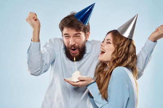 Birthday cake with candle man and woman corporate party fun holidays. High quality photo