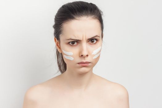 brunette bare shoulders face mask brushing cropped view skincare. High quality photo