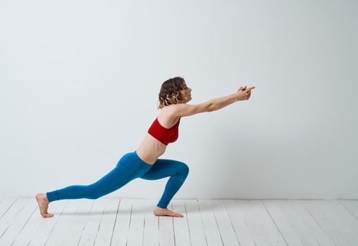 Woman doing gymnastics exercises yoga asana sportswear. High quality photo