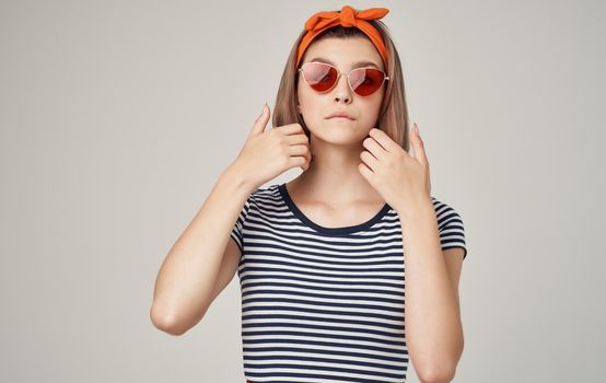 cheerful pretty woman with orange headband red skirt fun Studio. High quality photo