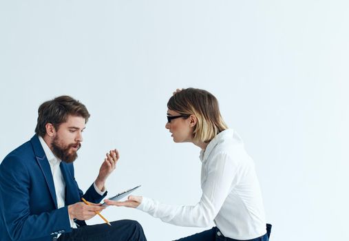 Business men and women sit on the couch communicating employees psychology work. High quality photo