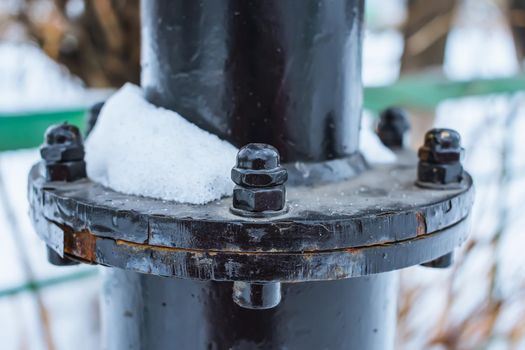 Close-up of a structural element of a rusty and corroded lamppost mount