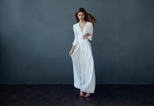attractive woman white dress glamor luxury studio gray background luxury. High quality photo