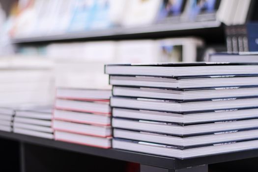 Stacked books in a bookstore, education and reading concept