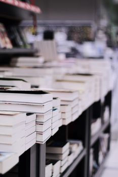 Stacked books in a bookstore, education and reading concept