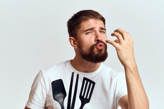 bearded man kitchenware cooking food cropped view. High quality photo