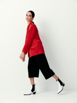 brunette red blazer studio clothing advertisement fashion. High quality photo