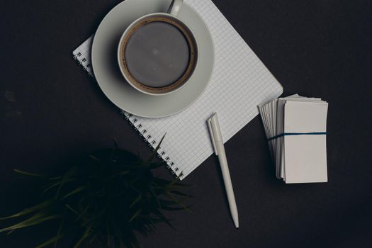 coffee cup desktop business card pen office close-up. High quality photo