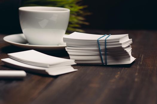 coffee cup on the table business cards office desktop business. High quality photo