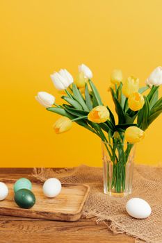 colorful eggs tulip bouquet spring holiday easter. High quality photo