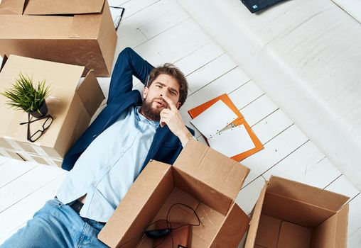 Business man with boxes office moving office official. High quality photo