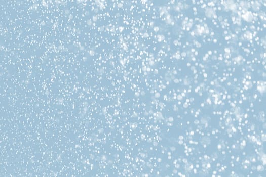 Abstract background of raindrops in light blue tonality