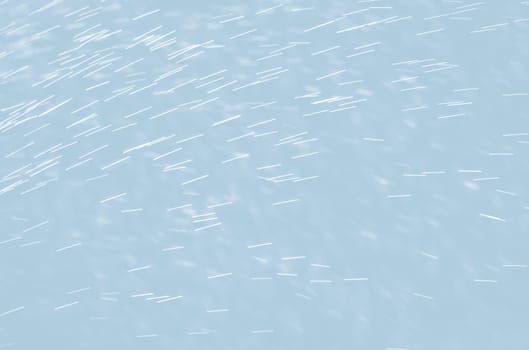 Abstract background of raindrops in light blue tonality