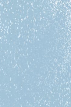 Abstract background of raindrops in light blue tonality