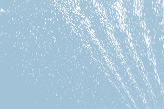 Abstract background of raindrops in light blue tonality