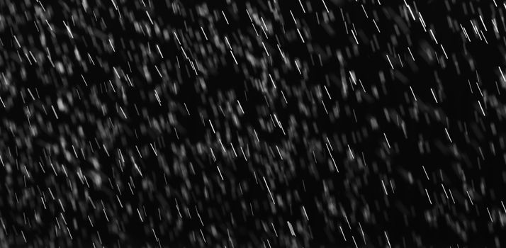 Rain on black. Abstract splashes of water on a black background for screen blending mode and photo retouching.