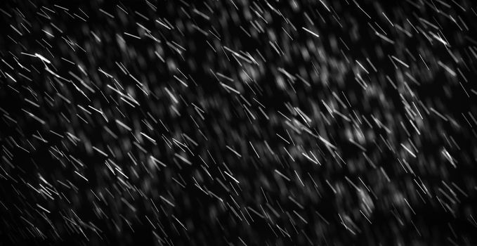 Rain on black. Abstract splashes of water on a black background for screen blending mode and photo retouching.