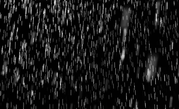 Rain on black. Abstract splashes of water on a black background for screen blending mode and photo retouching.