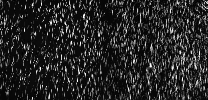 Rain on black. Abstract splashes of water on a black background for screen blending mode and photo retouching.