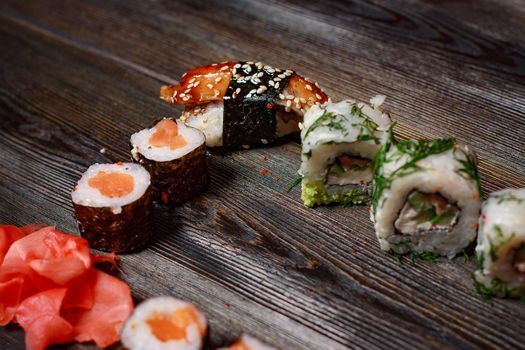 sushi rolls ginger chopsticks delicacy asian cuisine snack. High quality photo