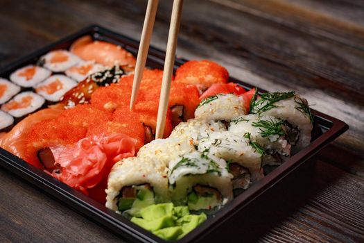 rolls red ginger restaurant delicacy asian cuisine wood background. High quality photo