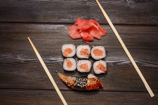 asian food sushi and roll set wooden sticks seafood. High quality photo